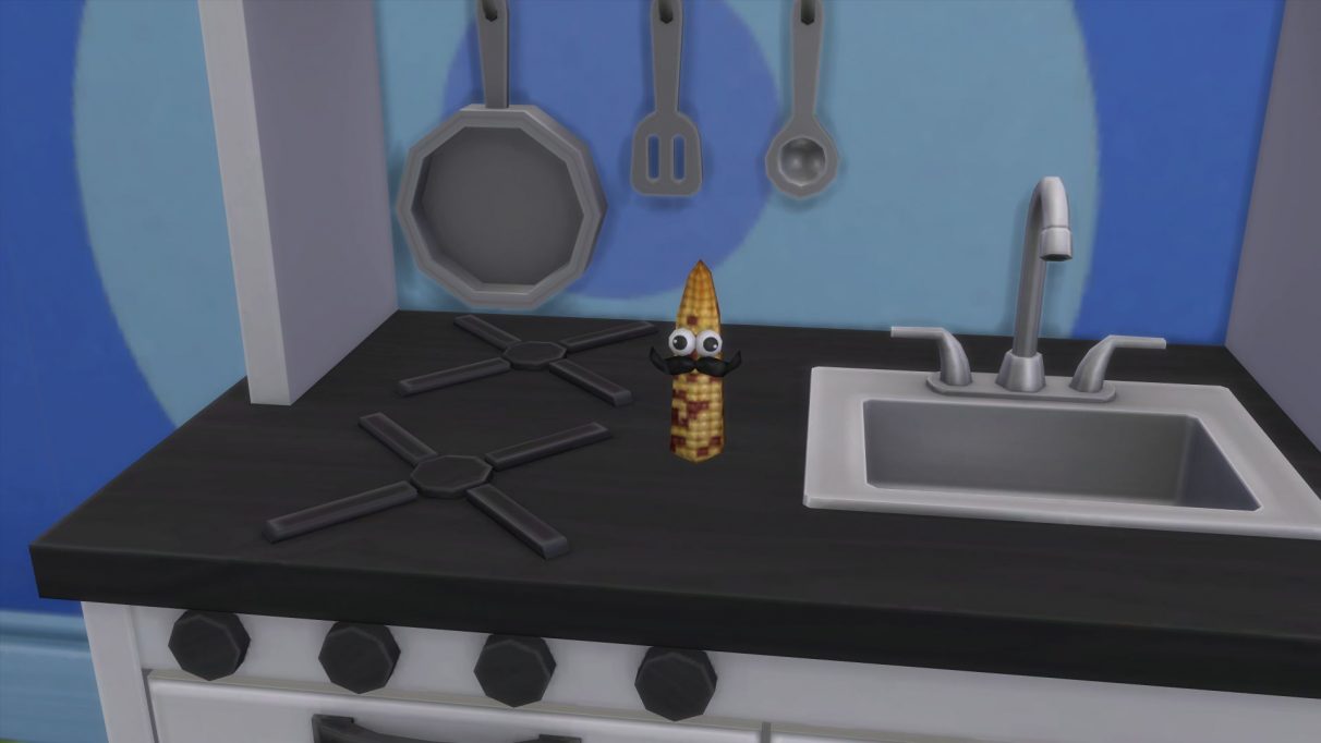 Una captura de pantalla de un juguete de mazorca de maíz que un niño pequeño puede crear con la cocina de juguete.  Tiene dos ojos saltones y un bigote del tipo que sería ideal para girar, si la mazorca tuviera manos.